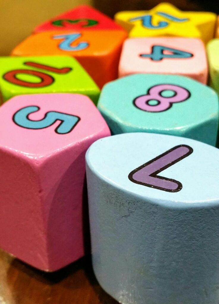 Close-up of colorful wooden blocks with numbers for educational fun.