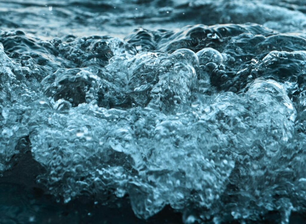 Close-up of ocean waves breaking near Sweden's coast, capturing dynamic water motion.