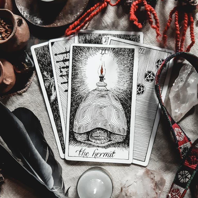 Close-up of tarot cards with crystals, creating a mystical and magical atmosphere.