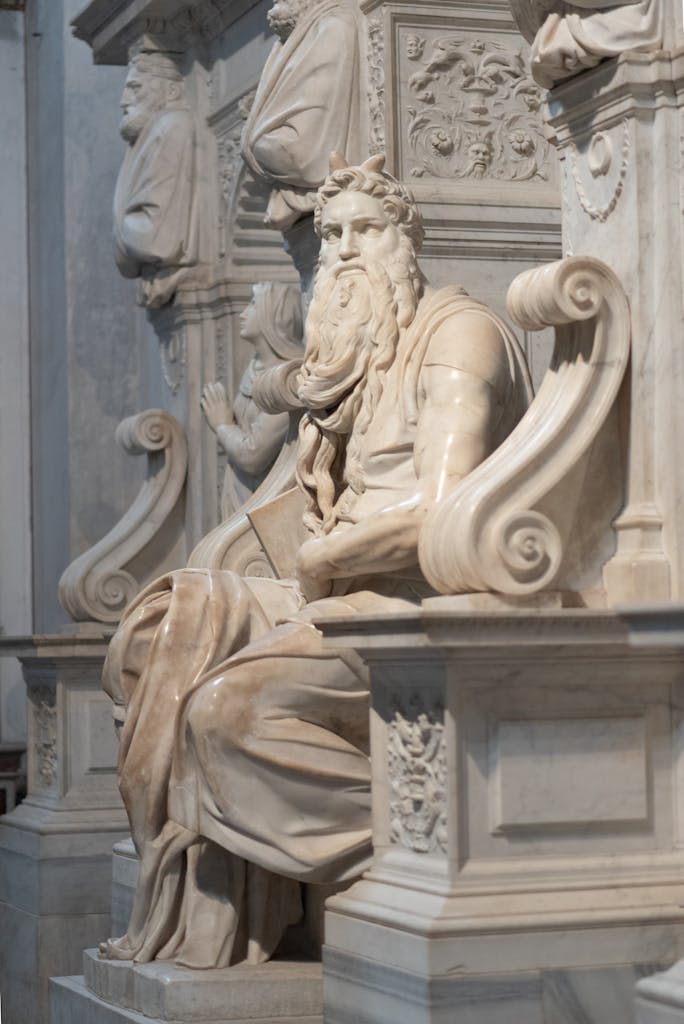 Close-up of Michelangelo's marble Moses sculpture in Rome, showcasing Renaissance artistry.